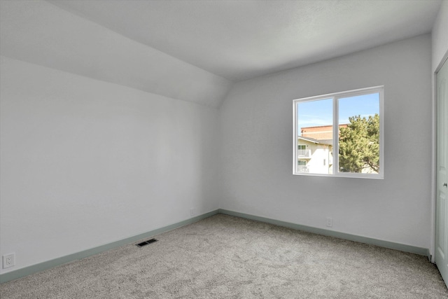 1801 W Sharp Ave, Spokane, WA 99201 - carpeted spare room with vaulted ceiling and baseboards