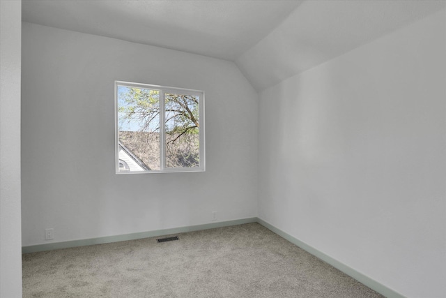 1801 W Sharp Ave, Spokane, WA 99201 - unfurnished room featuring light colored carpet and vaulted ceiling