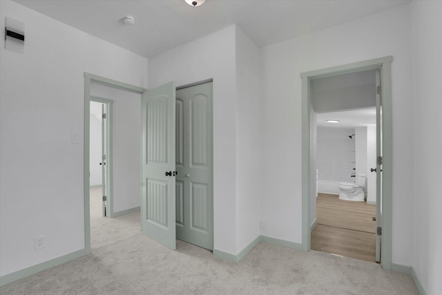 1801 W Sharp Ave, Spokane, WA 99201 - unfurnished bedroom with carpet floors, a closet, and ensuite bath
