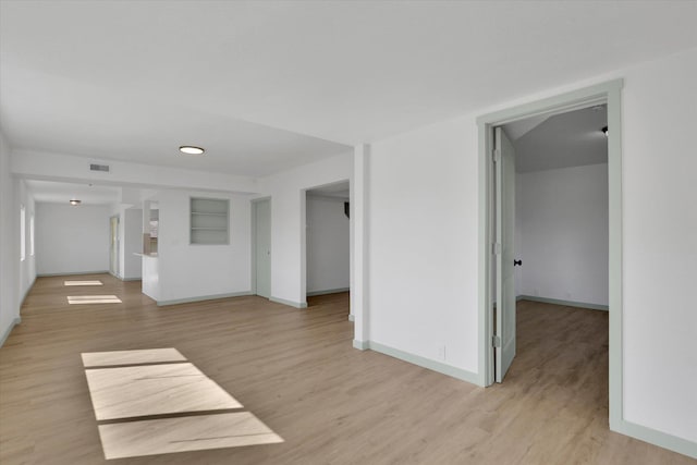 1801 W Sharp Ave, Spokane, WA 99201 - spare room featuring baseboards and light wood finished floors