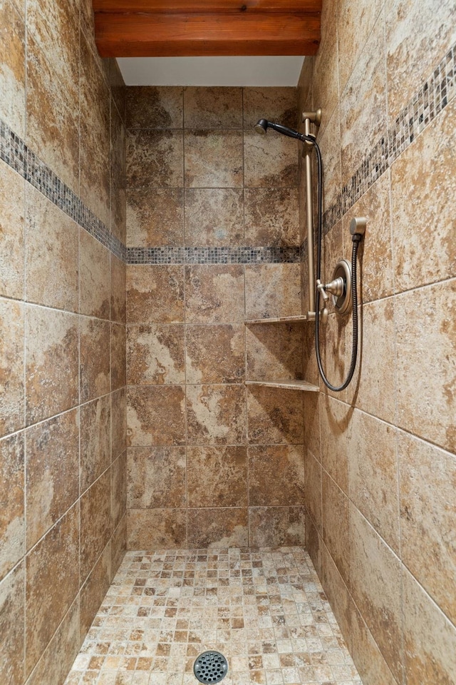 3247 Jumpoff Way, Valley, WA 99181 - bathroom featuring a tile shower and beamed ceiling