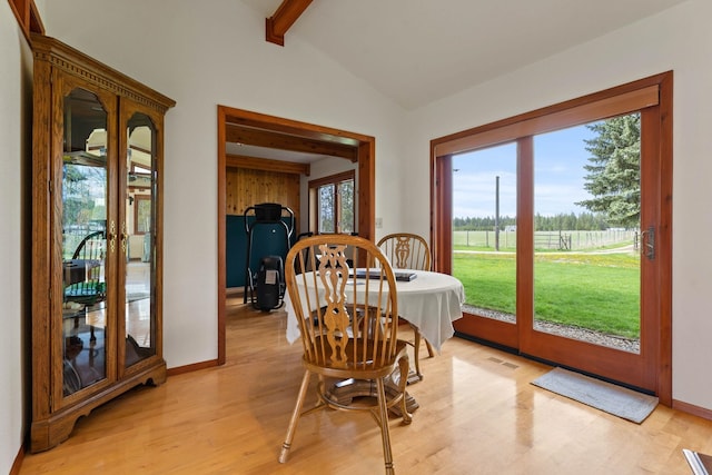 3247 Jumpoff Way, Valley, WA 99181 - dining space featuring a wealth of natural light, lofted ceiling with beams, light wood-type flooring, and baseboards