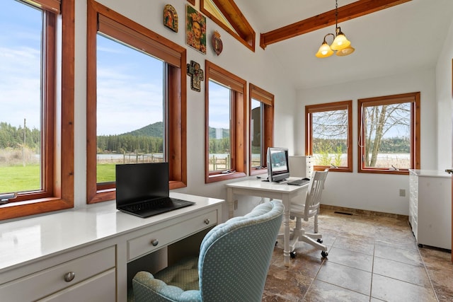 3247 Jumpoff Way, Valley, WA 99181 - office space with lofted ceiling with beams, a healthy amount of sunlight, and stone finish floor