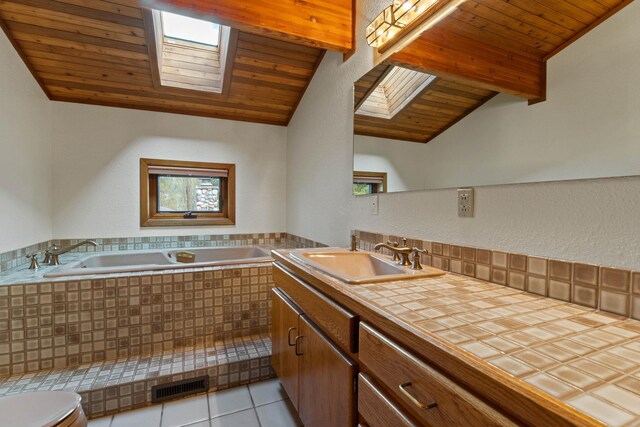 3247 Jumpoff Way, Valley, WA 99181 - bathroom with wooden ceiling, toilet, lofted ceiling with skylight, visible vents, and a bath