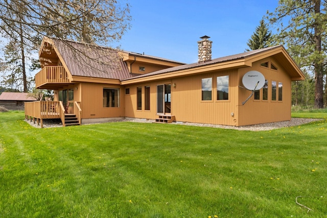 3247 Jumpoff Way, Valley, WA 99181 - back of property with a chimney, metal roof, a wooden deck, and a yard
