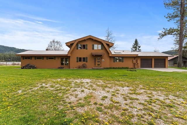 3247 Jumpoff Way, Valley, WA 99181 - view of front of home with metal roof, a garage, and a front yard