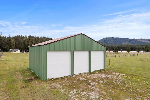 3247 Jumpoff Way, Valley, WA 99181 - detached garage with a rural view, a mountain view, and fence