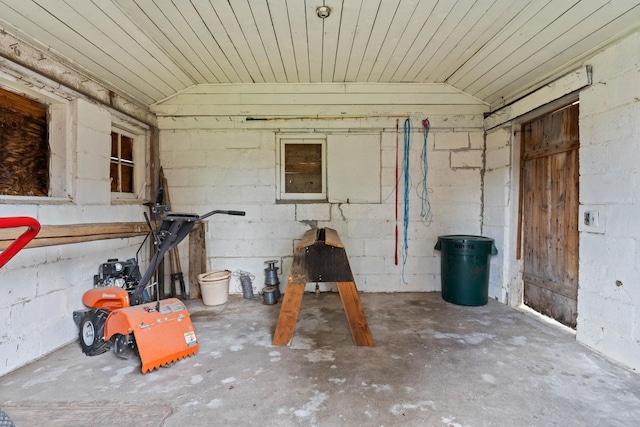 3247 Jumpoff Way, Valley, WA 99181 - exterior space featuring concrete block wall, unfinished concrete floors, and lofted ceiling