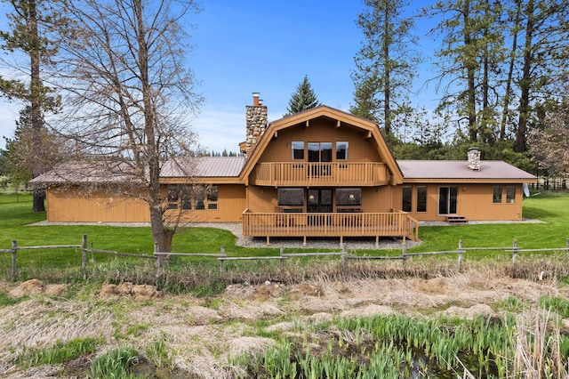 3247 Jumpoff Way, Valley, WA 99181 - back of house featuring a lawn, metal roof, a chimney, and a wooden deck