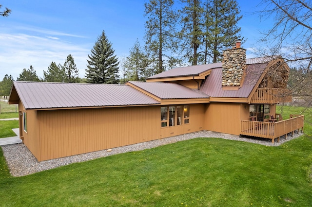 3247 Jumpoff Way, Valley, WA 99181 - rear view of property with a lawn, metal roof, a wooden deck, and a chimney