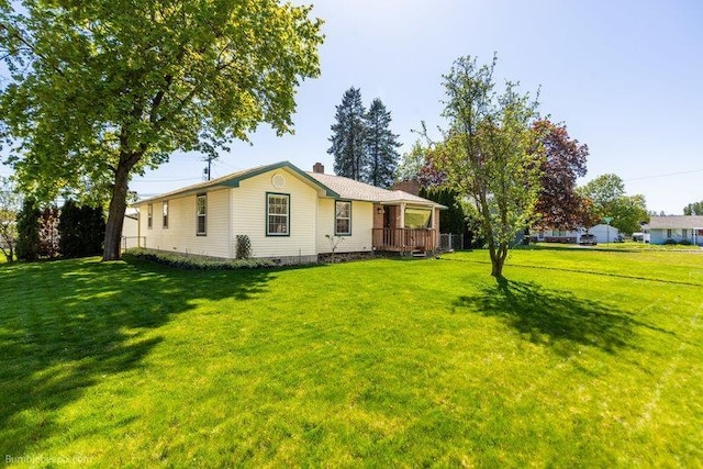 4023 W Hoffman Ave, Spokane, WA 99205 - view of front facade with a chimney and a front yard