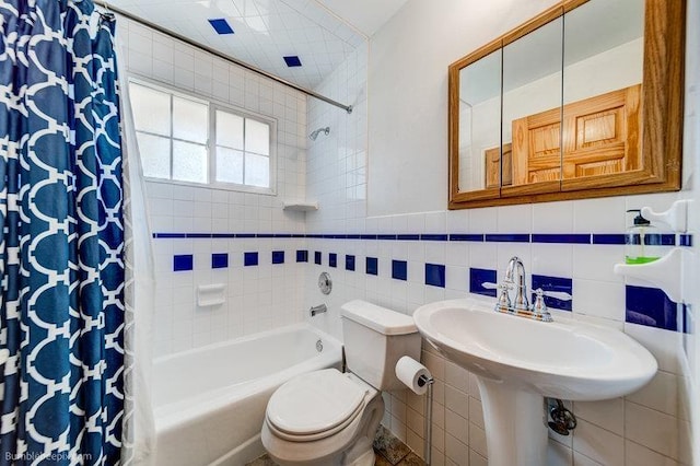4023 W Hoffman Ave, Spokane, WA 99205 - full bath with tile walls, toilet, shower / tub combo, and a sink