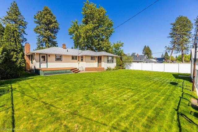 4023 W Hoffman Ave, Spokane, WA 99205 - back of house with a yard, a chimney, fence, and a deck