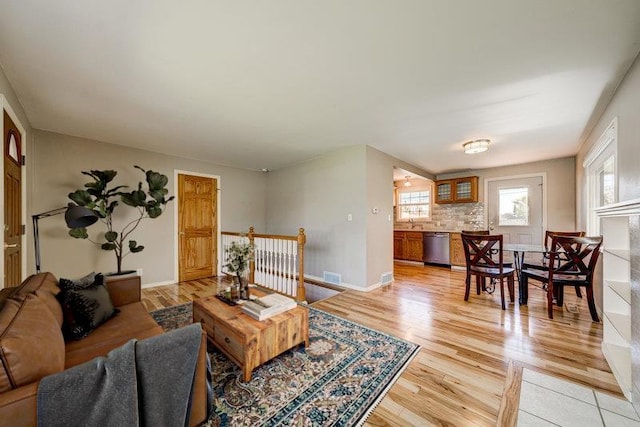 4023 W Hoffman Ave, Spokane, WA 99205 - living area with light wood finished floors, plenty of natural light, and visible vents