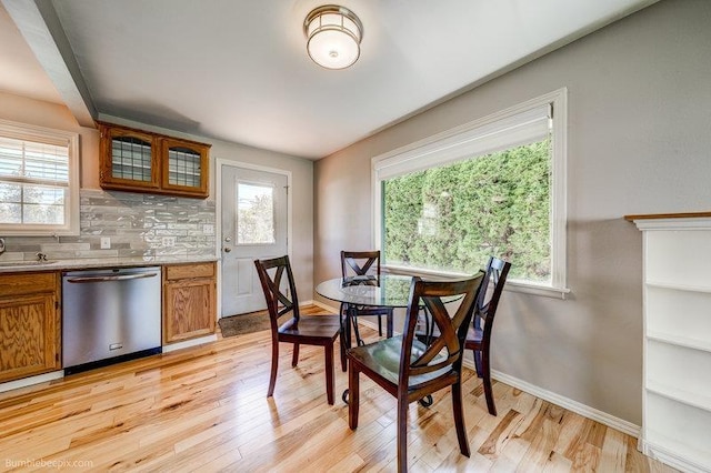 4023 W Hoffman Ave, Spokane, WA 99205 - dining area with baseboards and light wood-style floors