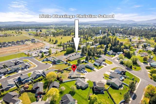 bird's eye view with a mountain view and a residential view