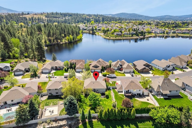 bird's eye view with a water and mountain view and a residential view