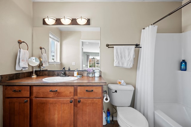 bathroom with toilet, vanity, a healthy amount of sunlight, and shower / bathtub combination with curtain