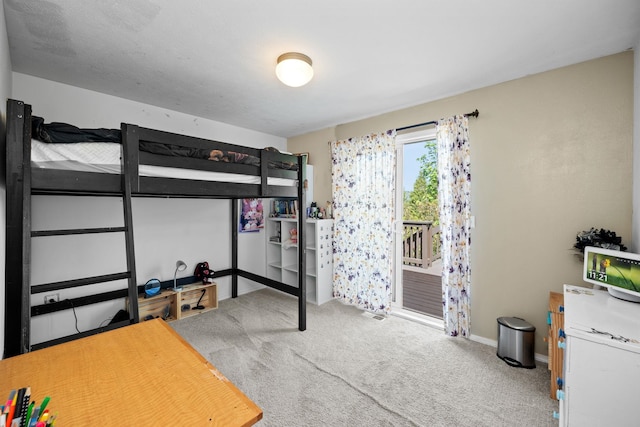 bedroom featuring baseboards, carpet flooring, and access to outside