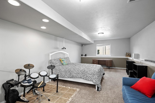 bedroom featuring a textured ceiling, baseboards, and recessed lighting