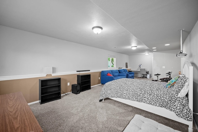 carpeted bedroom featuring baseboards and recessed lighting