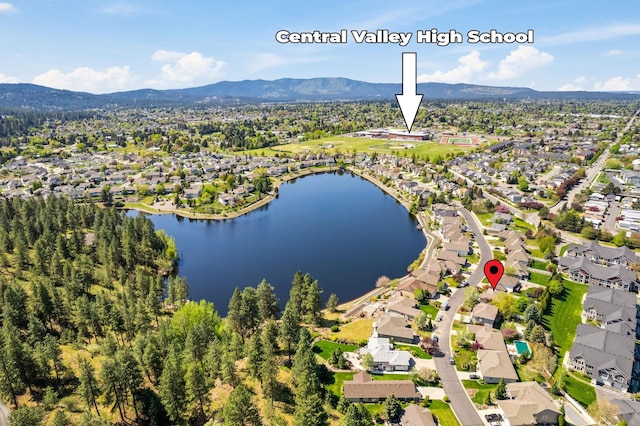aerial view featuring a water and mountain view and a residential view