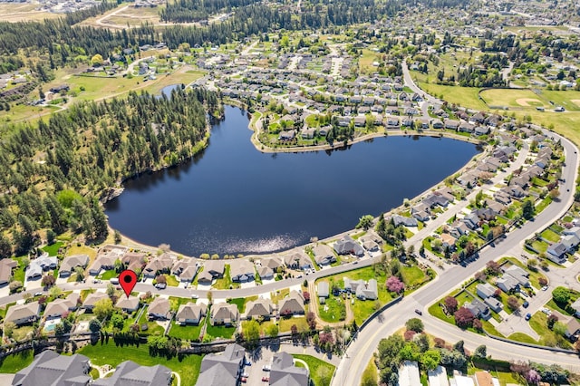 bird's eye view with a water view and a residential view