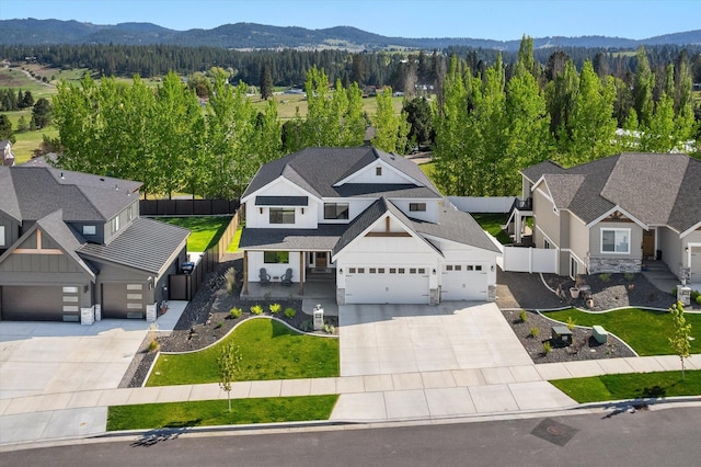 birds eye view of property featuring a mountain view and a forest view