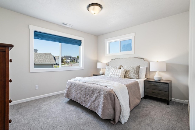 bedroom featuring carpet, baseboards, and visible vents