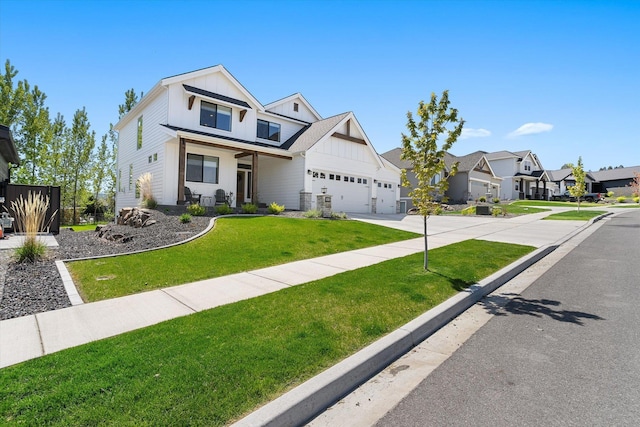 view of front of home featuring a residential view, concrete driveway, a garage, a front yard, and board and batten siding