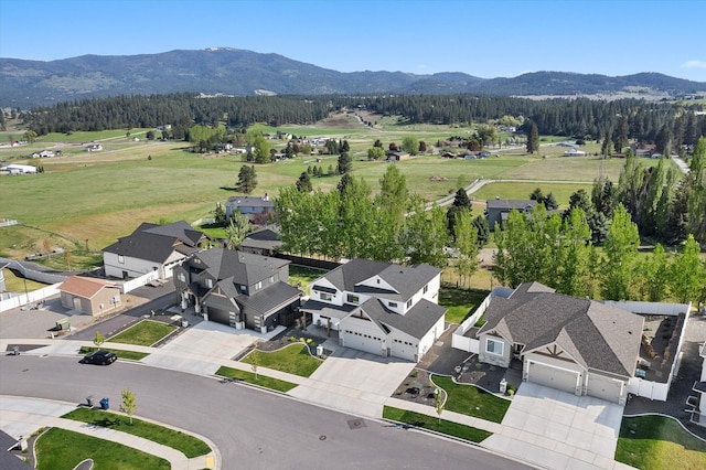 aerial view featuring a mountain view and a residential view