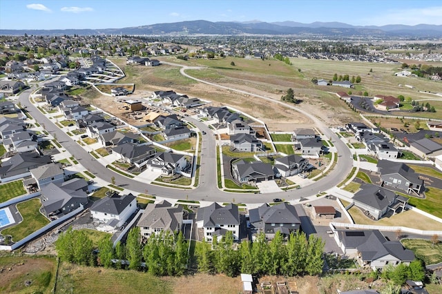 aerial view featuring a mountain view and a residential view