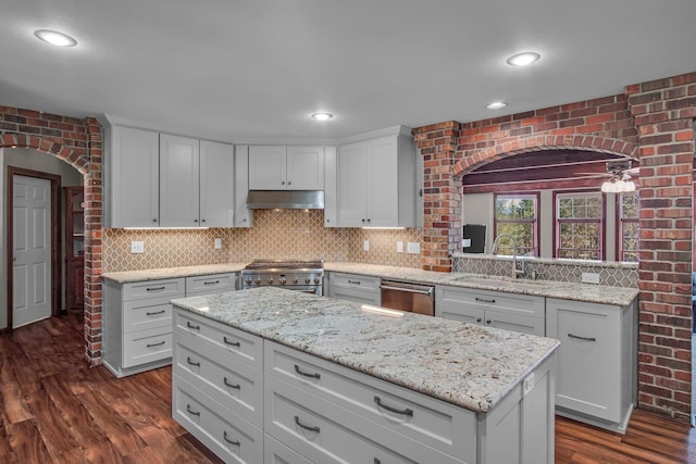 21724 N Perry Rd, Colbert, WA 99005 - kitchen featuring a sink, white cabinets, dark wood-type flooring, under cabinet range hood, and appliances with stainless steel finishes