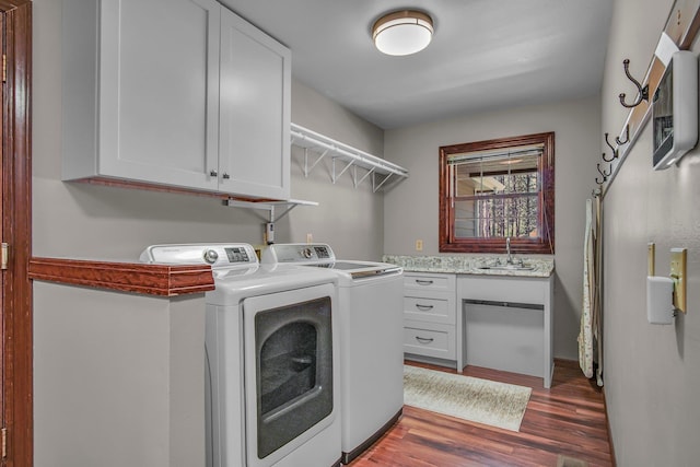 21724 N Perry Rd, Colbert, WA 99005 - laundry room featuring washer and clothes dryer, cabinet space, a sink, and wood finished floors