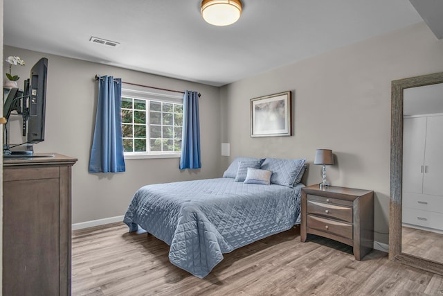 21724 N Perry Rd, Colbert, WA 99005 - bedroom with light wood finished floors, baseboards, and visible vents