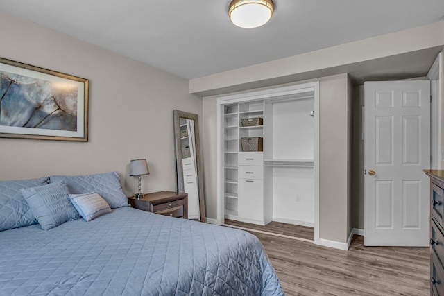 21724 N Perry Rd, Colbert, WA 99005 - bedroom featuring a closet, baseboards, and wood finished floors
