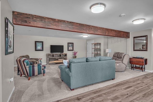 21724 N Perry Rd, Colbert, WA 99005 - living area with wood finished floors, baseboards, and beamed ceiling