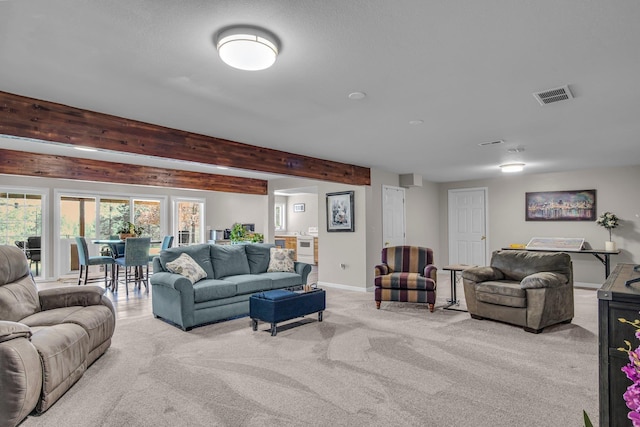 21724 N Perry Rd, Colbert, WA 99005 - living room featuring carpet floors, baseboards, visible vents, and beam ceiling