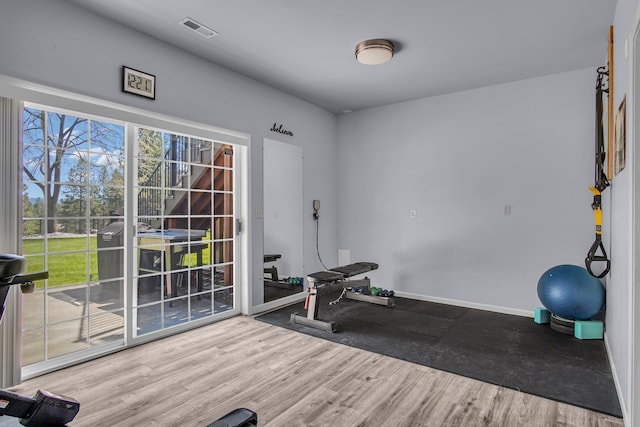21724 N Perry Rd, Colbert, WA 99005 - workout area with wood finished floors, visible vents, and baseboards