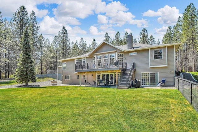 21724 N Perry Rd, Colbert, WA 99005 - rear view of house with a patio, a deck, a lawn, stairway, and a fenced backyard