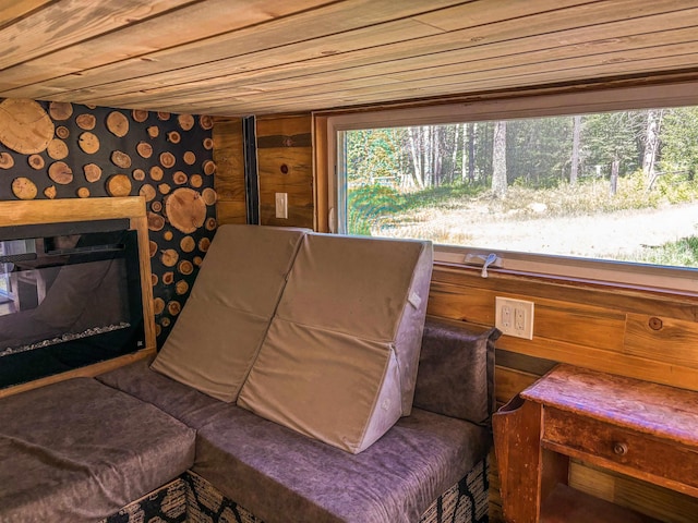 living area featuring wood ceiling