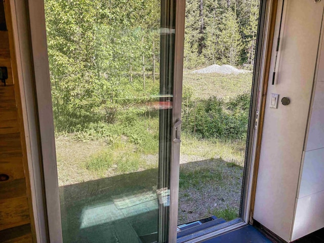 doorway featuring a view of trees