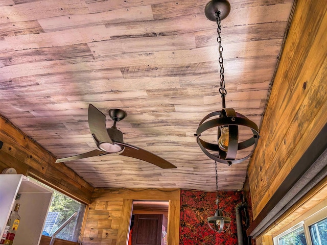 interior details with wood ceiling, wooden walls, ceiling fan, and a fire extinguisher
