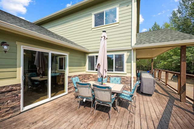 deck featuring outdoor dining area