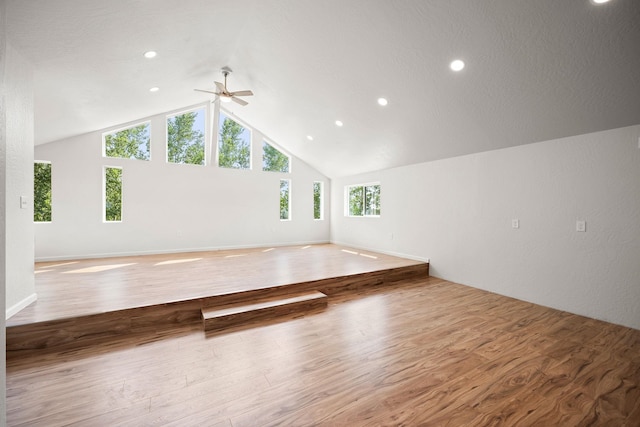 additional living space featuring lofted ceiling, a ceiling fan, recessed lighting, and wood finished floors