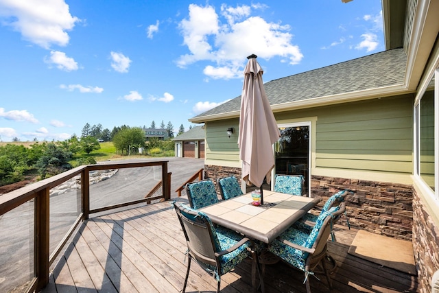 wooden deck with outdoor dining space