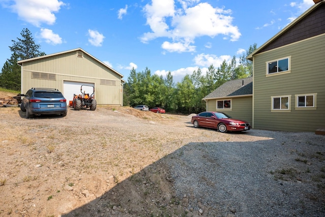 exterior space featuring an outbuilding and a garage