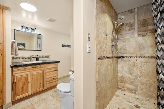 16717 E Washington Rd, Valleyford, WA 99036 - bathroom featuring toilet, a tile shower, vanity, and tile patterned flooring