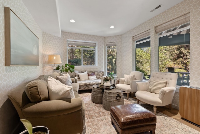 sunroom / solarium with a healthy amount of sunlight and visible vents