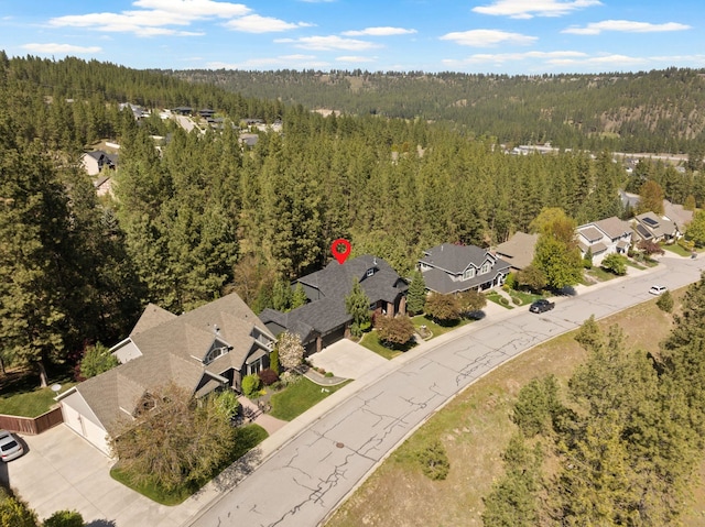 aerial view with a residential view and a view of trees